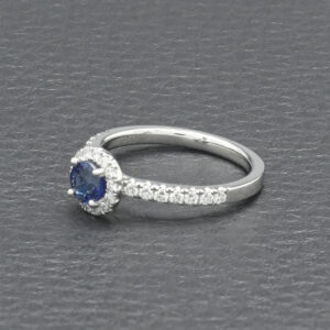 Platinum 0.20ct Diamond And 0.50ct Sapphire Halo Ring