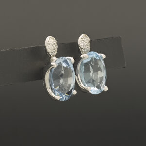 18ct White Gold Blue Topaz And 0.08ct Diamond Stud Earrings